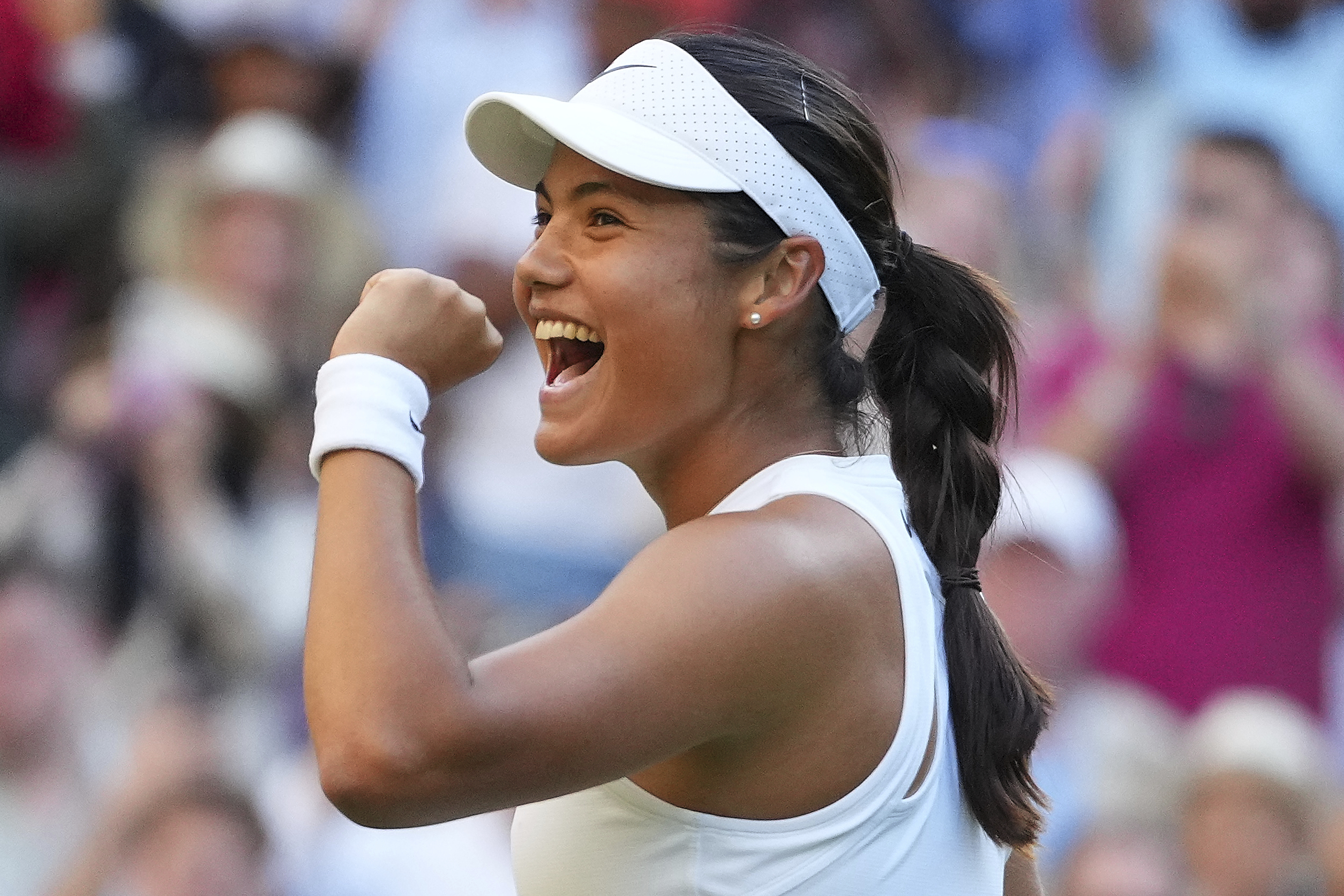 Emma Raducanu of Britain celebrates winning the second round women's singles match against Marketa Vondrousova of the Czech Republic at the Wimbledon Tennis Championships in London, Wednesday, July 2, 2025.