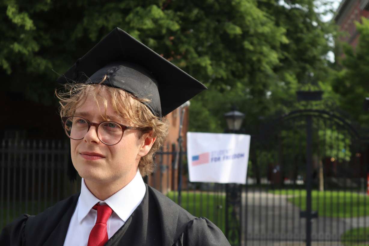 Harvard University graduating senior Leo Gerdén, an international student from Sweden, stands outside the Harvard University gates before a student protest against President Donald Trump's recent sanctions against Harvard, May 27, in Cambridge, Mass.