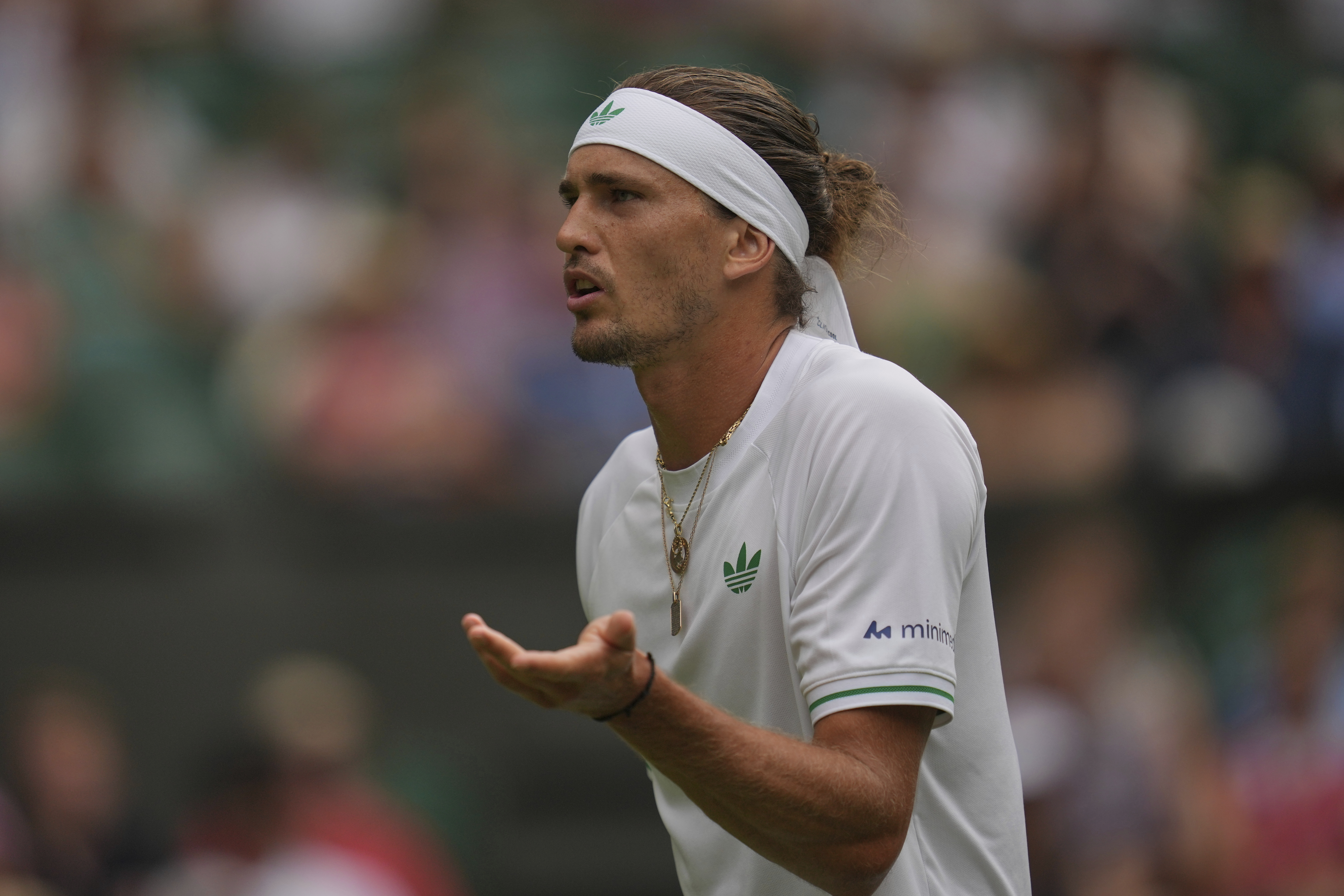 Alexander Zverev of Germany reacts as he plays Arthur Rinderknech of France during their first round men's singles match at the Wimbledon Tennis Championships in London, Tuesday, July 1, 2025. 