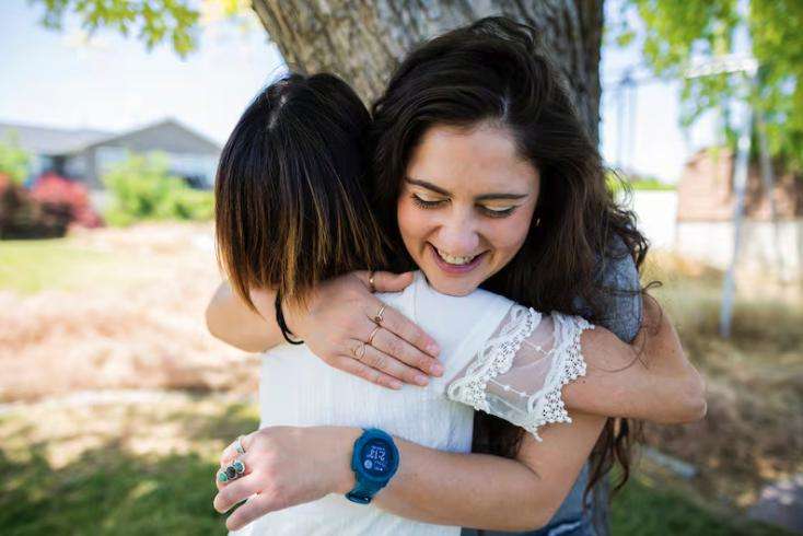 Renee DeHaan, left, who trekked to Mount Everest base camp on her prosthetic leg this spring, hugs her prosthetist and friend Quincey Brabant, right, who accompanied her on the trek, at DeHaan’s home in South Jordan on June 7.