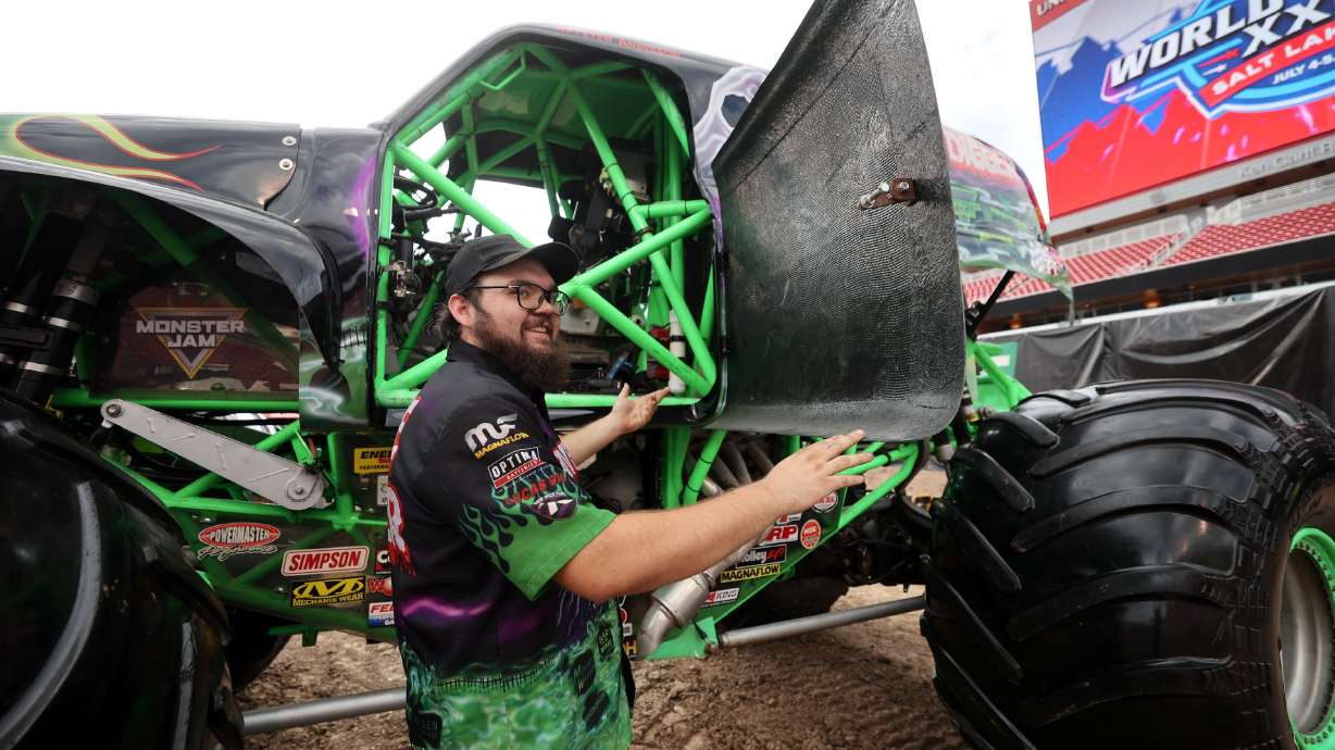Sebastian Harden, crew chief, gets into Grave Digger to move it during media day ahead of the Monster Jam World Finals XXIV at Rice-Eccles Stadium in Salt Lake City on Wednesday.