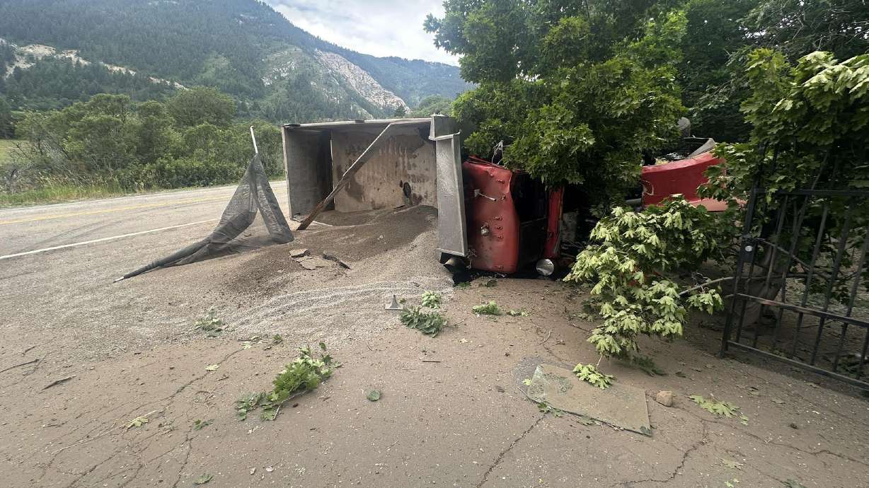 North Ogden Canyon Road was closed in both directions after a dump truck rolled over and crashed on Thursday.