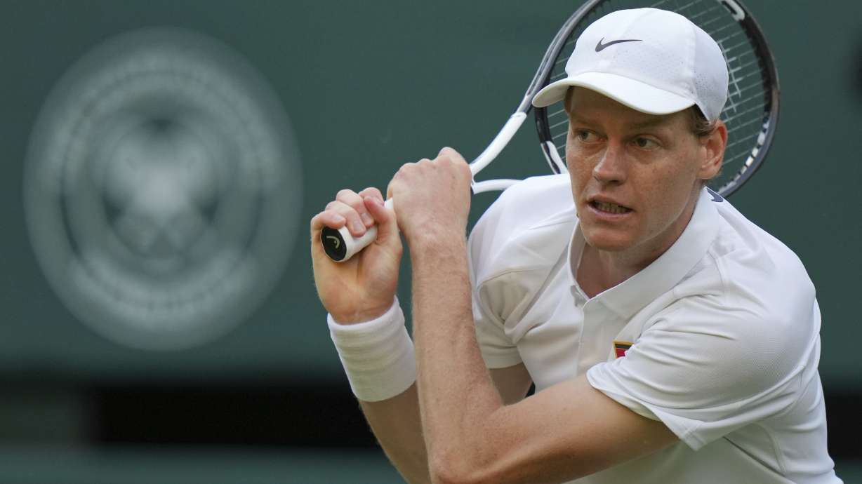 Jannik Sinner of Italy returns to Aleksandar Vukic of Australia during their second round men's singles match at the Wimbledon Tennis Championships in London, Thursday, July 3, 2025.