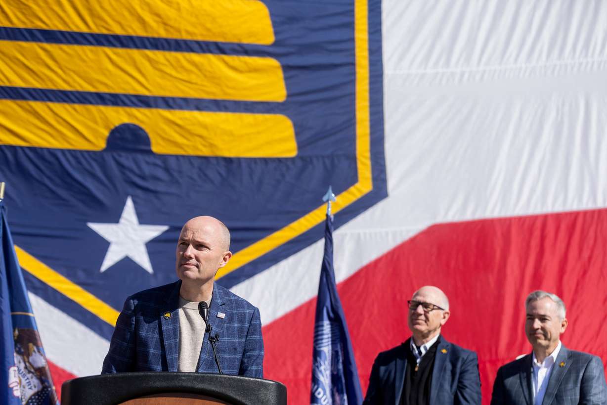 Gov. Spencer Cox speaks alongside former state Rep. Steve Handy and Sen. Daniel McCay, R-Riverton, on Utah Flag Day and to celebrate Utah's new state flag, the beehive flag, at the Capitol in Salt Lake City on March 9, 2024.
