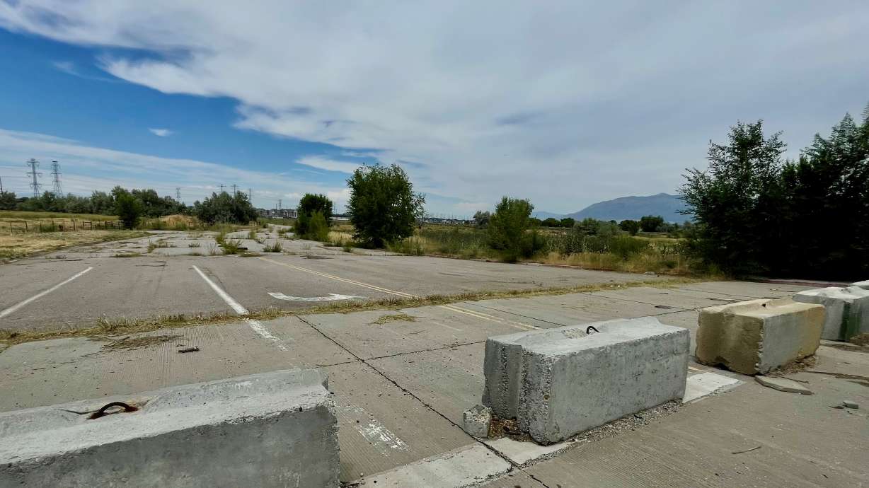 The site of a planned Walmart Supercenter in West Haven, to the right in the photo, on Thursday. Hunter Drive, now closed to motorists, is the current access point to the land.