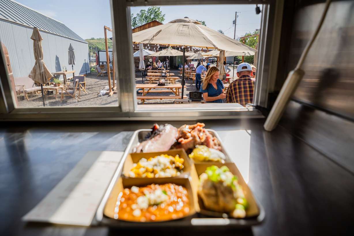 An order waits at the counter to be served to customers of SmokeWood, a mobile food trailer, at Gracie's Farm in Wanship on Friday, June 20, 2025.