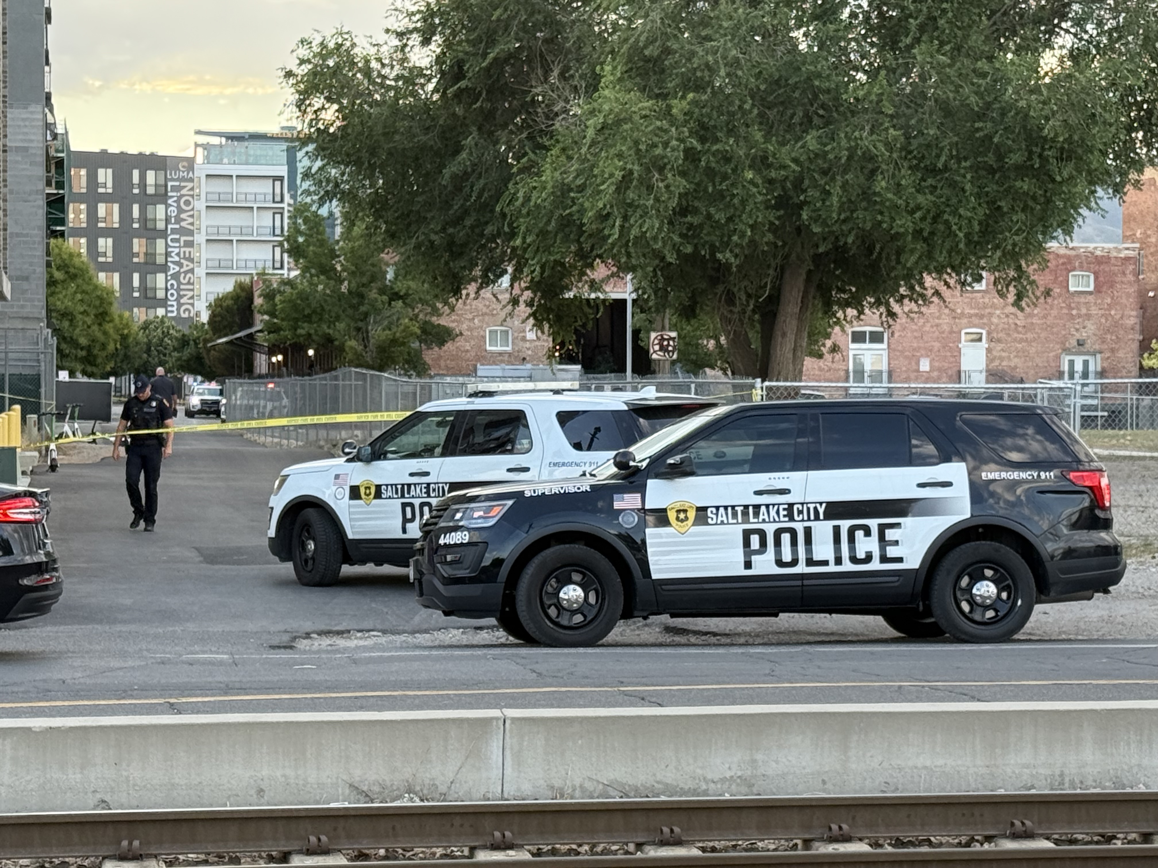 Police respond to a shooting in Salt Lake City on Friday. They said one man is in critical condition, and they believe the suspect fled the scene.