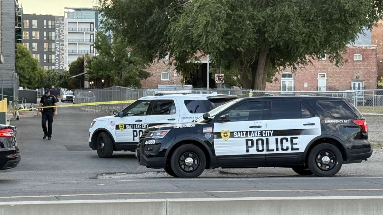 Police respond to a shooting in Salt Lake City on Friday. They said one man is in critical condition, and they believe the suspect fled the scene.