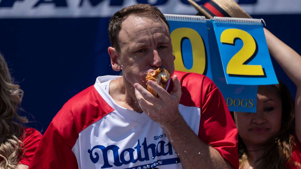 Competitive eater Joey Chestnut eats hot dogs during the 2025 Nathan's Famous Fourth of July hot dog eating contest in the Coney Island section of the Brooklyn borough of New York, Thursday.