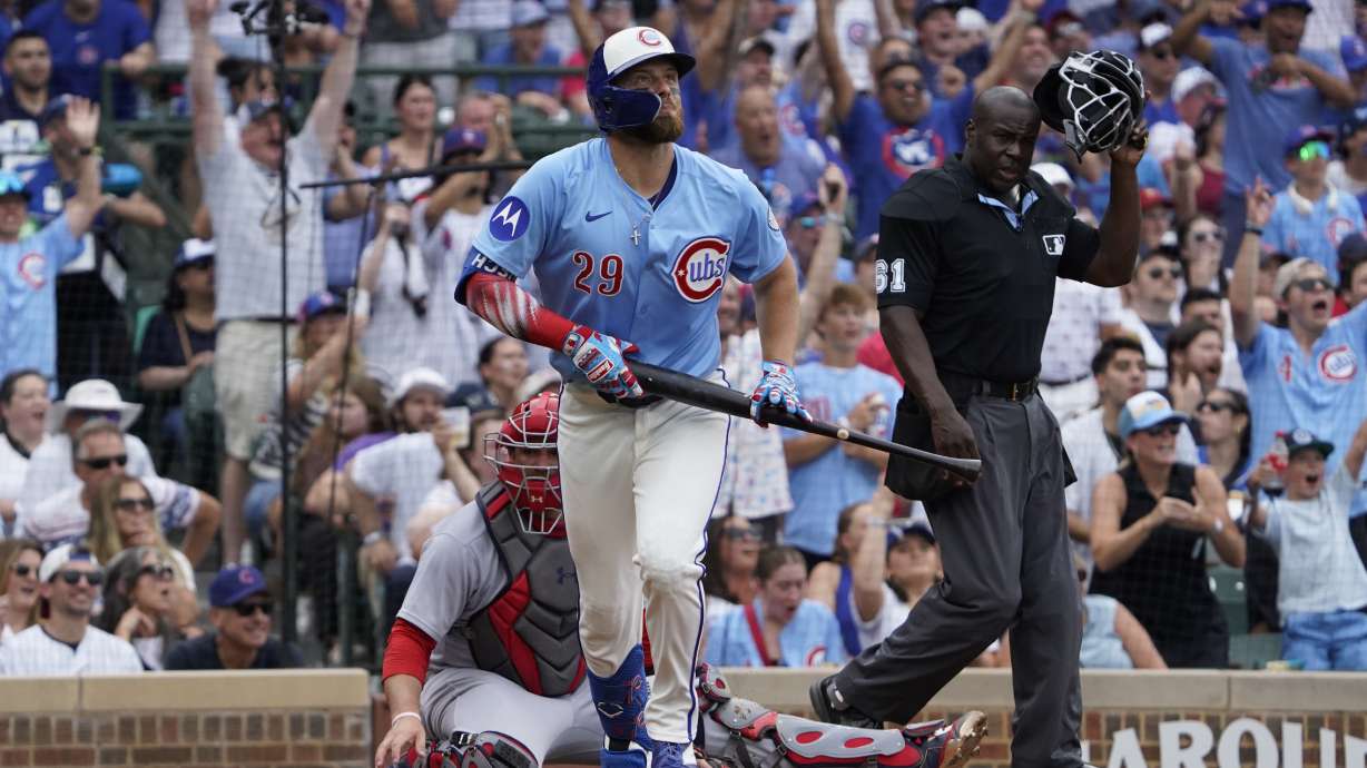 Chicago Cubs' Michael Busch hits a two-run home run against the St. Louis Cardinals during the third inning of a baseball game Friday, July 4, 2025, in Chicago.