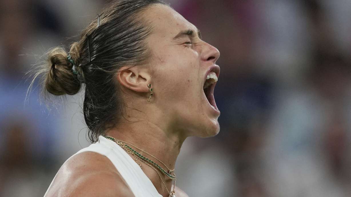 Aryna Sabalenka of Belarus reacts after winning a point against Emma Raducanu of Britain during a third round women's singles match at the Wimbledon Tennis Championships in London, Friday, July 4, 2025.