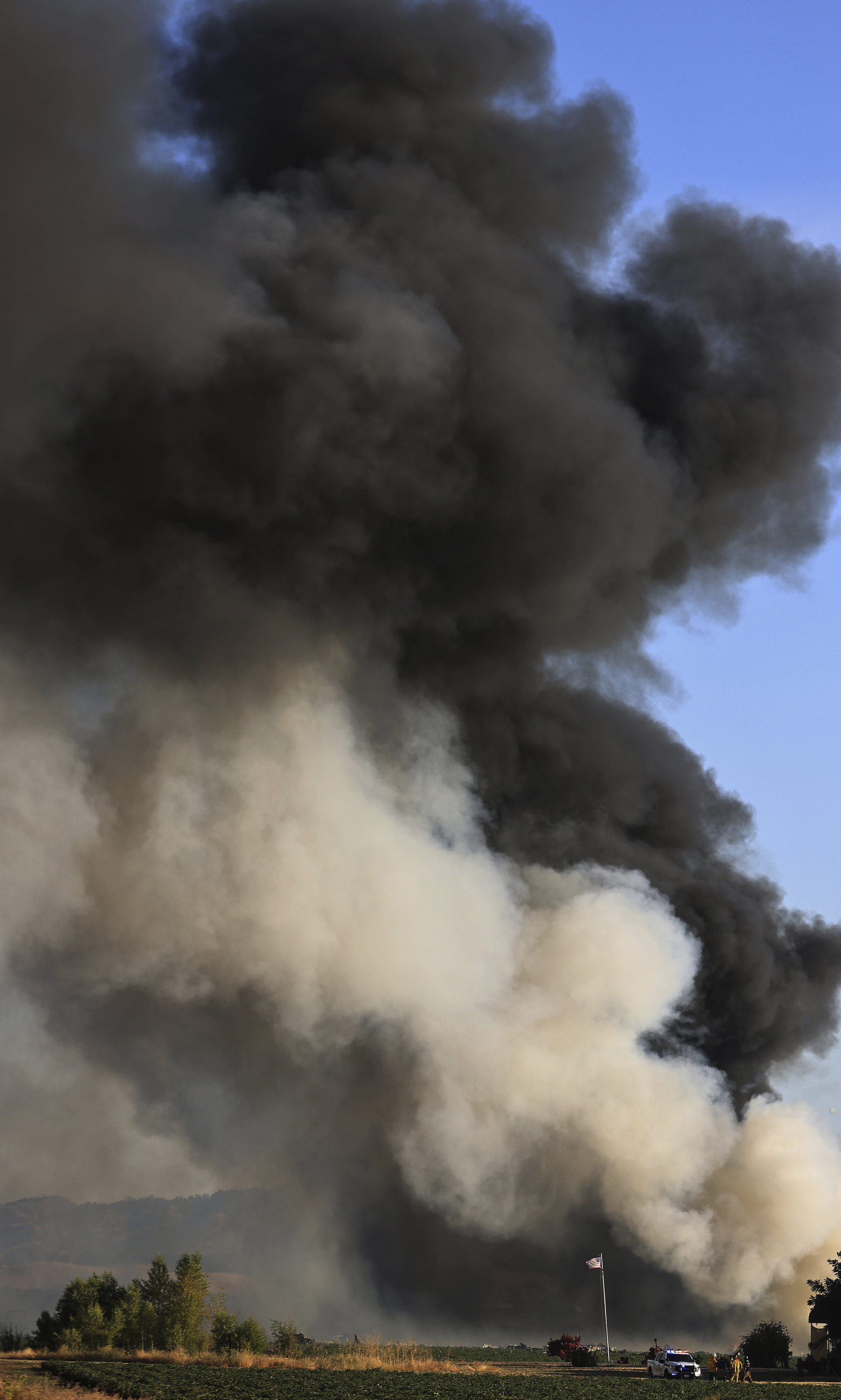 Smoke and flames rise during a fireworks warehouse explosion near Esparto, Calif., Tuesday.