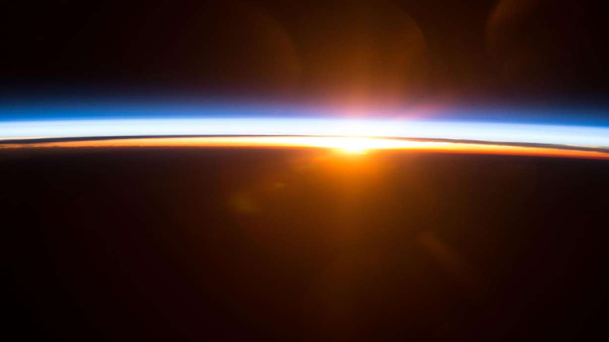 The sun rises over Earth's horizon as seen from the International Space Station.