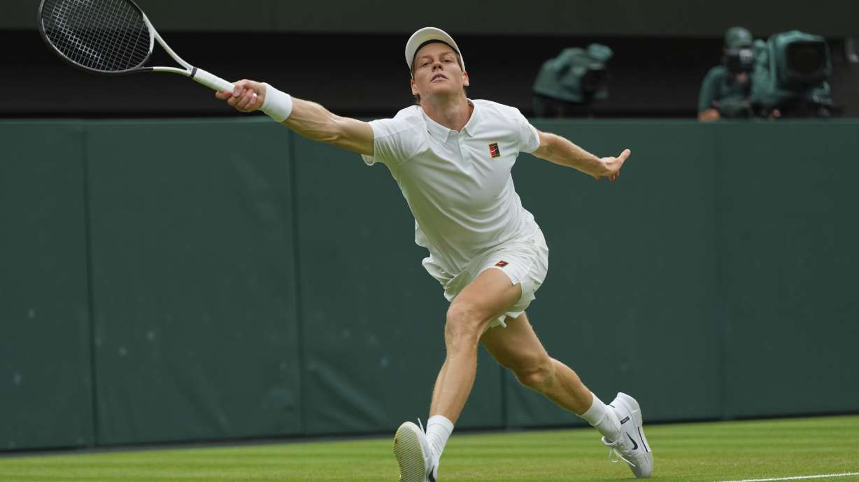 Jannik Sinner of Italy returns to Pedro Martinez of Spain during a third round men's singles match at the Wimbledon Tennis Championships in London, Saturday, July 5, 2025.