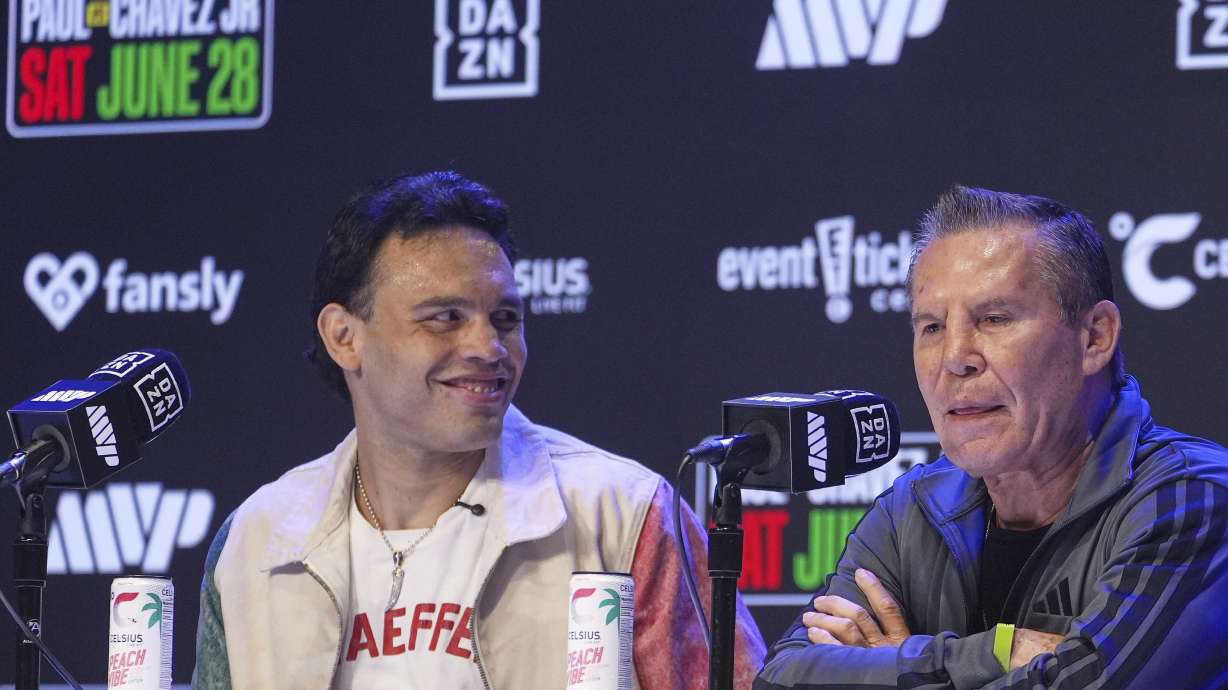 FILE - Boxers Cesar Chavez Jr,, left, smiles towards his father Julio Cesar Chavez, Mexico's former world champion, during a boxing news conference at the Avalon Hollywood Theatre in Los Angeles, May 14, 2025.