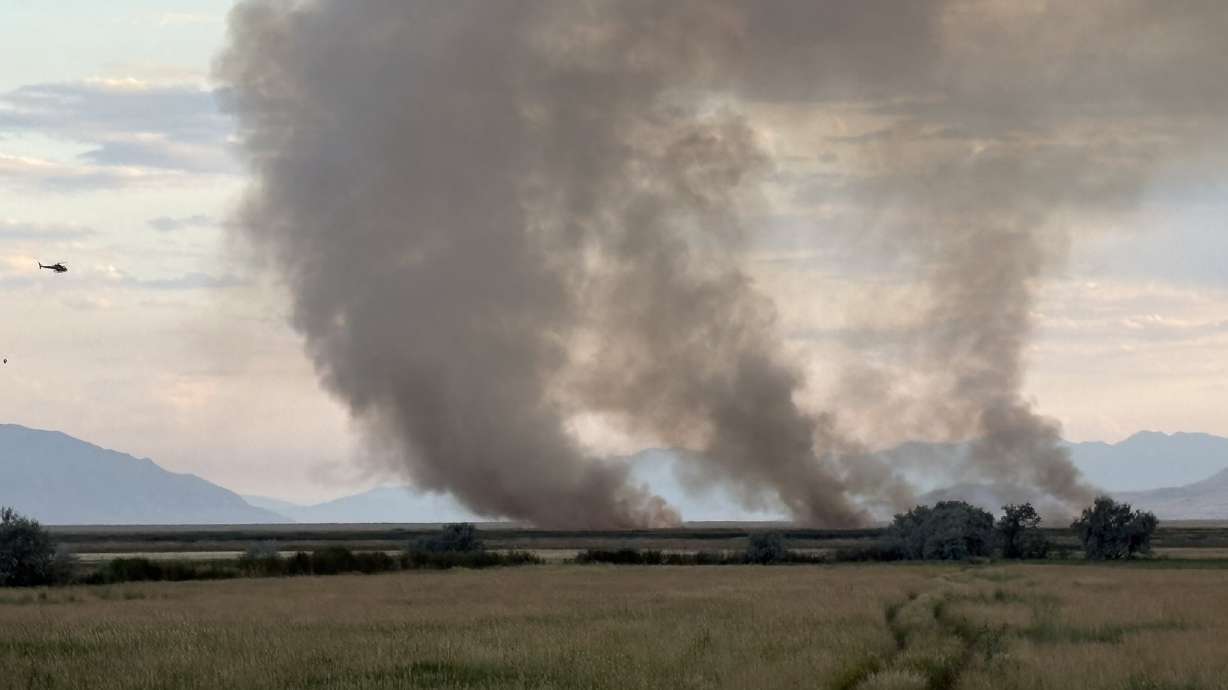 The Duck Club Fire burns in Davis County, west of Kaysville and Layton in the wetlands area. The fire was one of a dozen firefighters responded to on the Fourth of July.