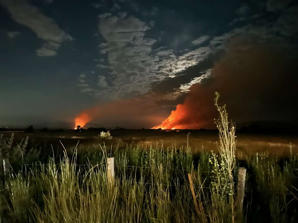 The Duck Club Fire burns in Davis County, west of Kaysville and Layton in the wetlands area on July 4. The fire was one of a dozen that firefighters responded to on Fourth of July.