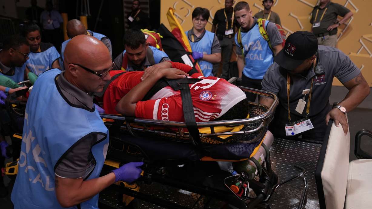Bayern Munich's Jamal Musiala is taken off the field after an injury during the Club World Cup quarterfinal soccer match between PSG and Bayern Munich in Atlanta, Saturday, July 5, 2025.