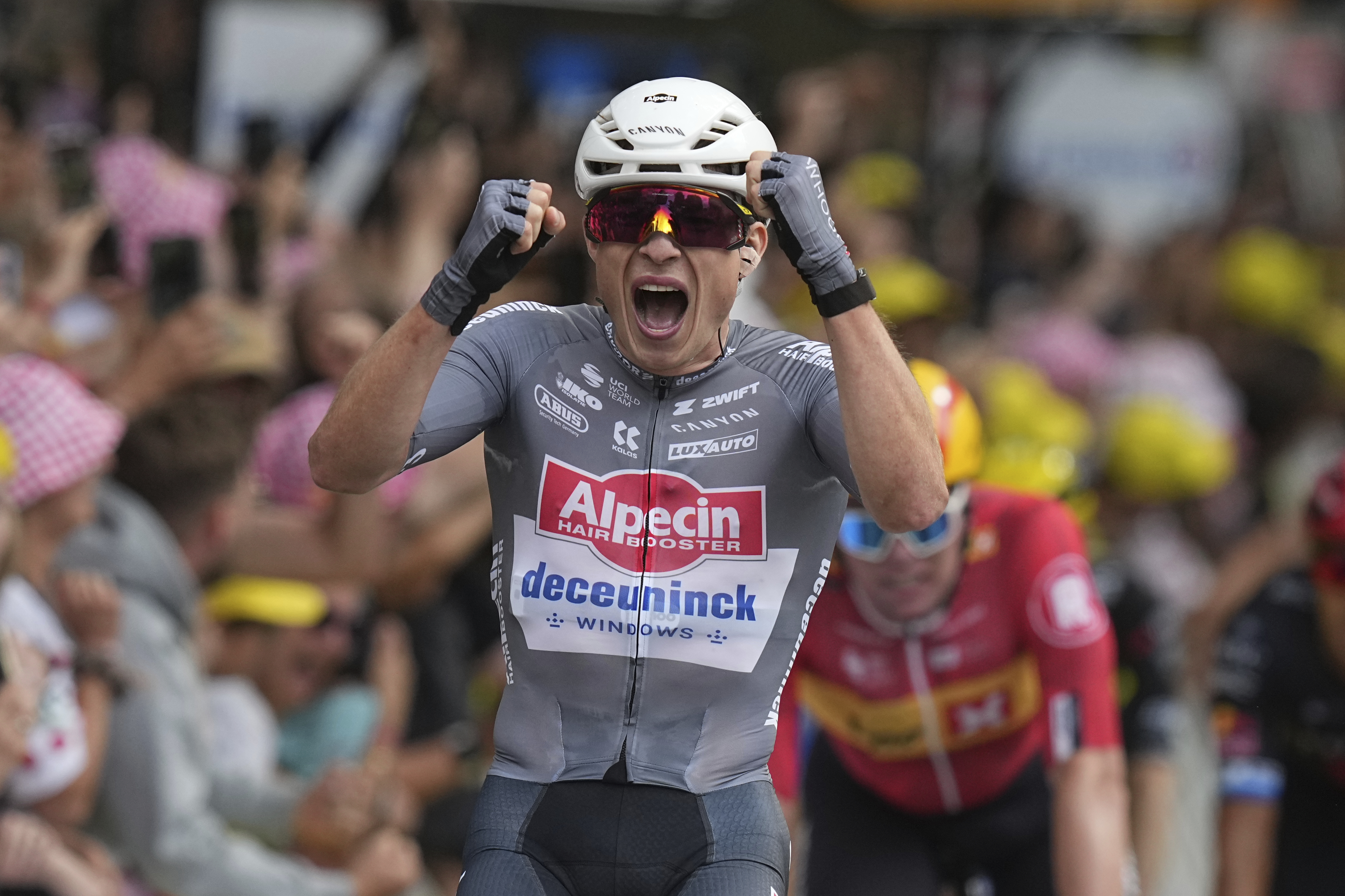 Belgium's Jasper Philipsen celebrates as he crosses the finish line to win the first stage of the Tour de France cycling race over 184.9 kilometers (114.9 miles) with start and finish in Lille, France, Saturday, July 5, 2025.