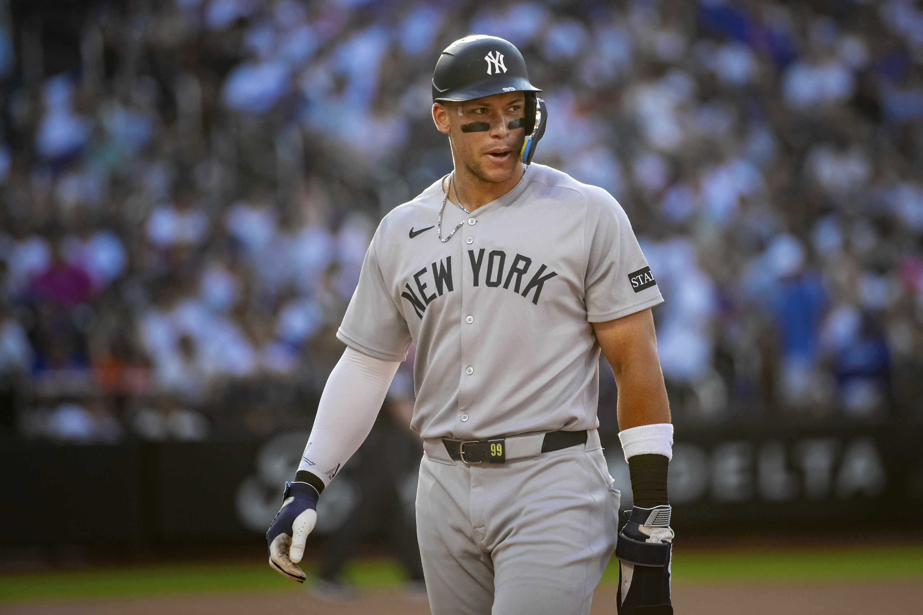 New York Yankees' Aaron Judge leaves the field after not scoring in the eighth inning of a baseball game against the New York Mets, Saturday, July 5, 2025, in New York. 