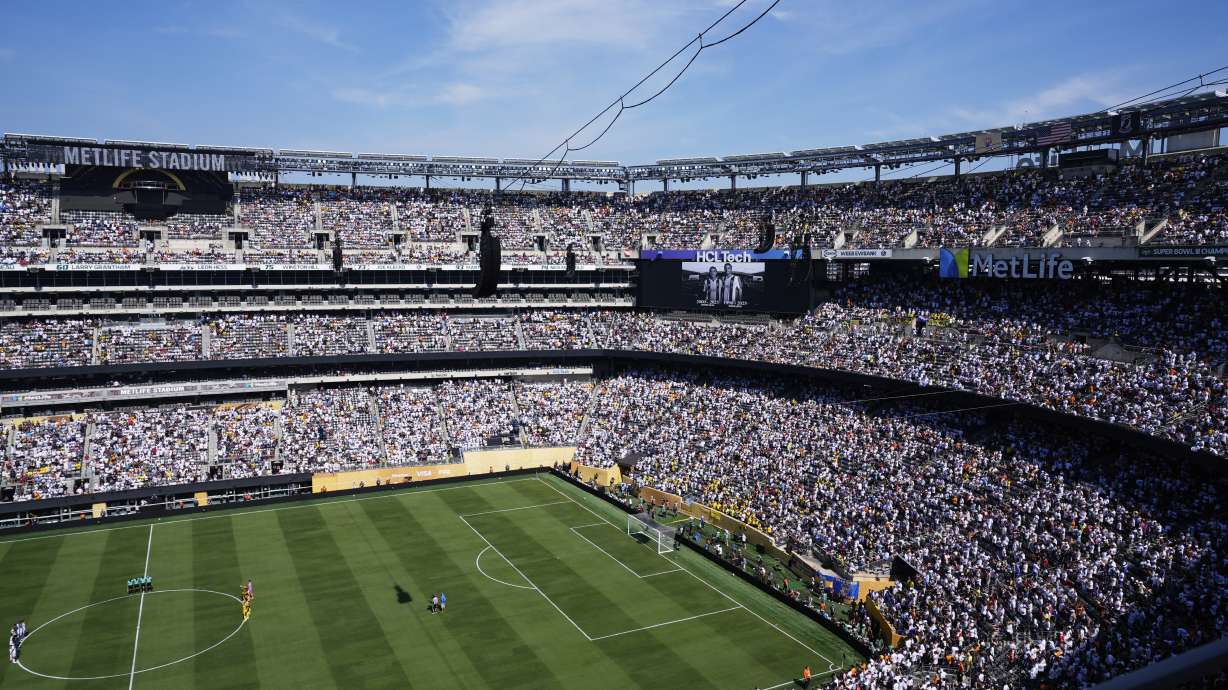 Players and fans observe a minute of silent in memory of Portugal international and Liverpool player Diogo Jota and his brother Andre Silva prior the Club World Cup quarterfinal soccer match between Real Madrid and Borussia Dortmund in East Rutherford, N.J., Saturday, July 5, 2025.