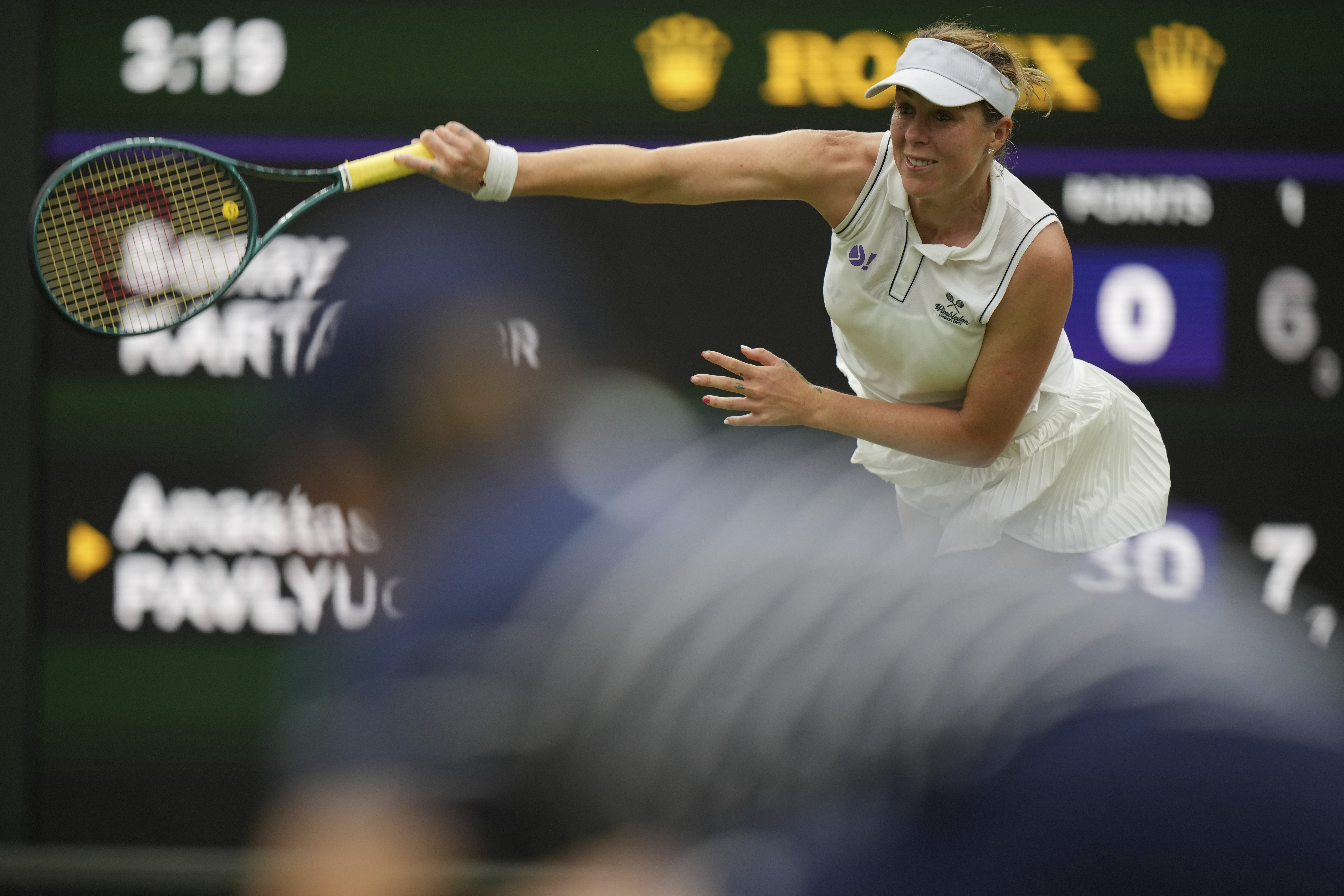 Russia's Anastasia Pavlyuchenkova serves to Sonay Kartal of Britain during a fourth round women's singles match at the Wimbledon Tennis Championships in London, Sunday, July 6, 2025. 