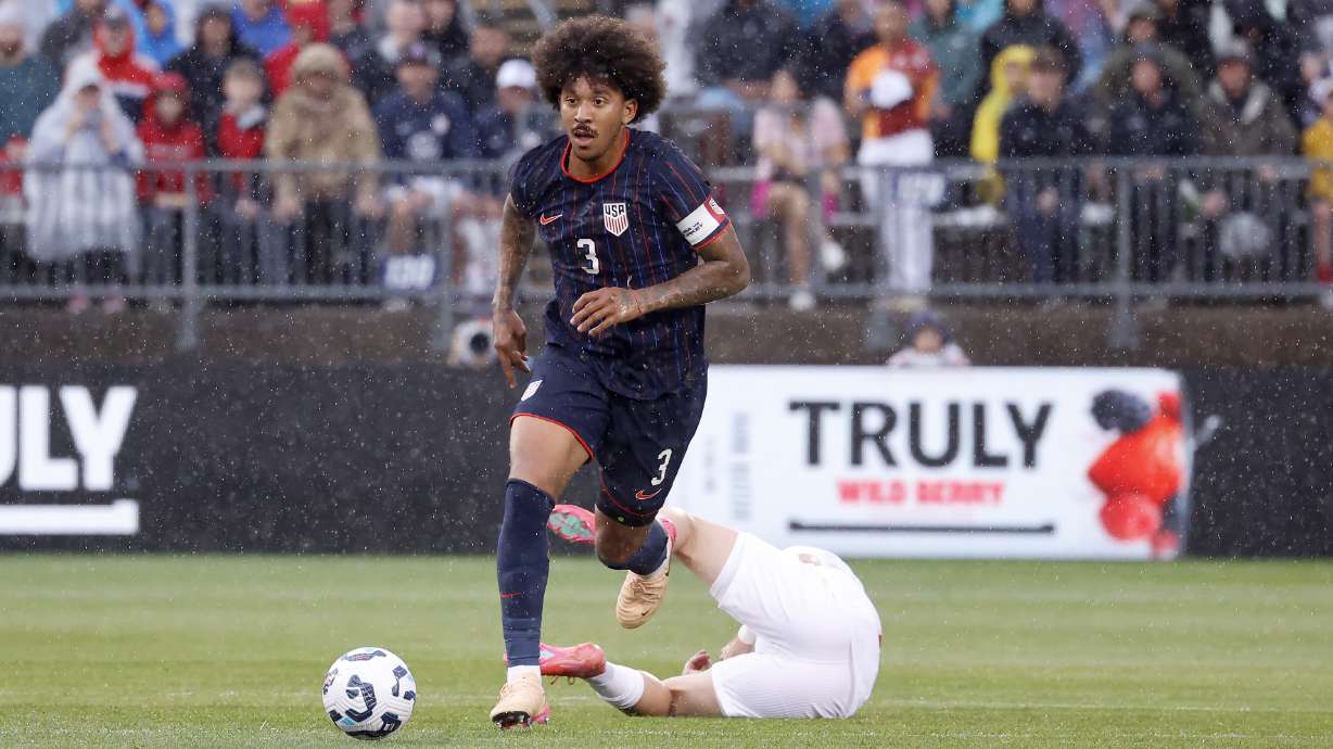 United States defender Chris Richards (3) dribble the ball up the field past a fallen Turkey defender during the first half of an international friendly soccer game, Saturday, June 7, 2025, in East Hartford, Conn.