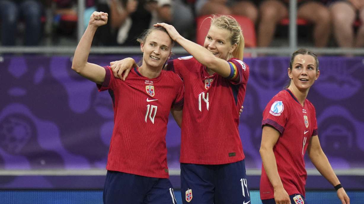 Norway's Caroline Graham, left, celebrates with Ada Hegerberg after scoring her side's second goal during the Euro 2025, group A, soccer match between Norway and Finland at Stade de Tourbillon in Sion, Switzerland, Sunday, July 6, 2025.