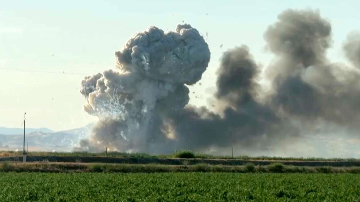 In this image taken from video, smoke and flames rise from a fireworks warehouse explosion on July 1, in Esparto, Calif.