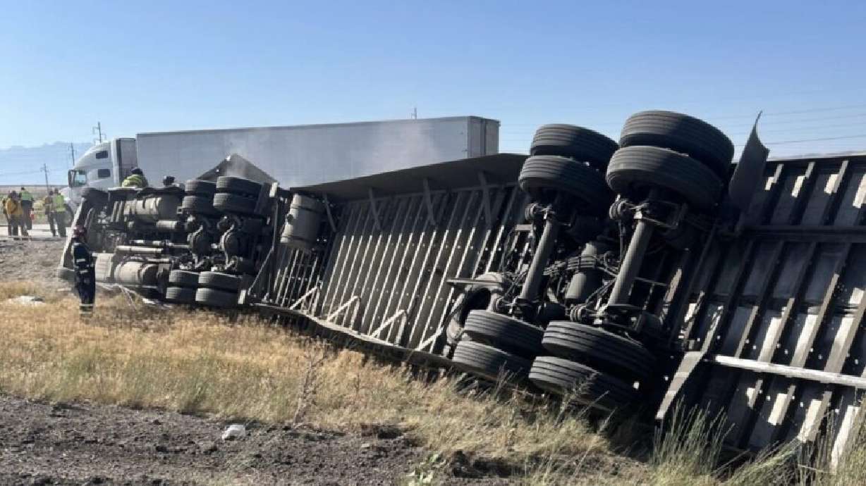 A semitruck hit the median on Interstate 80 and rolled Sunday morning near Salt Lake City, leaving the driver dead.