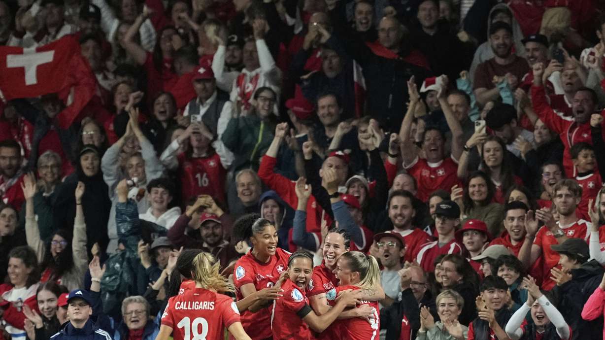 Switzerland's Geraldine Reuteler celebrates with team mates after scoring the opening goal during the Euro 2025, group A, soccer match between Switzerland and Iceland at Stadion Wankdorf in Bern, Switzerland, Sunday, July 6, 2025.