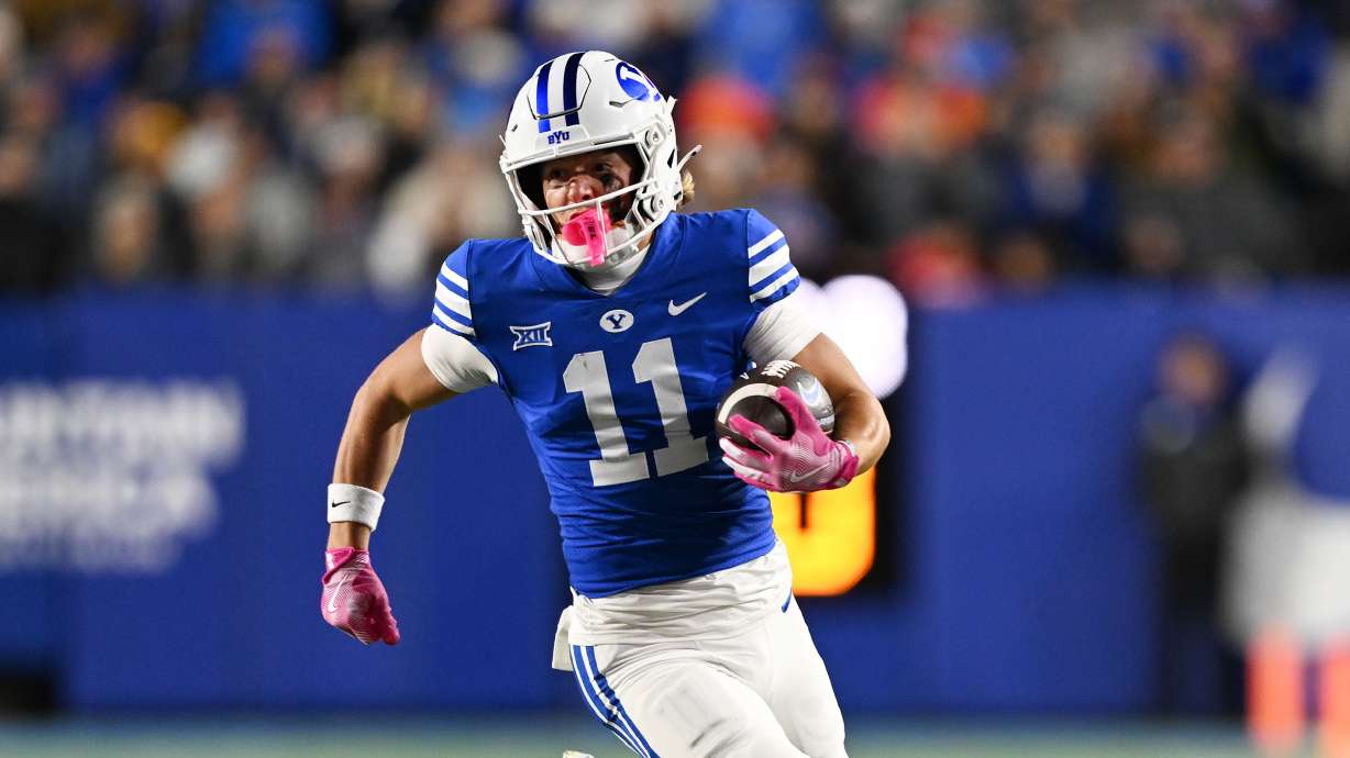 Brigham Young wide receiver Parker Kingston (11) rounds the edge on an end around as BYU and Oklahoma State play in Provo at LaVell Edwards Stadium on Friday Oct. 18, 2024.