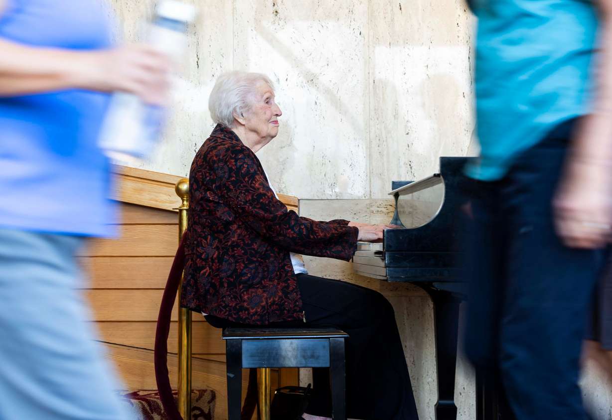 Doreen Woolley plays the piano for arriving audience members in the lobby of the Randall L. Jones Theatre before a theatrical performance at the Utah Shakespeare Festival in Cedar City, June 20.