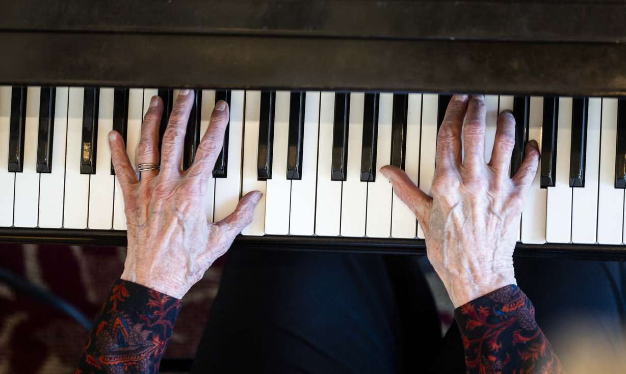 Doreen Woolley’s hands dance across the piano keys as she plays in the lobby of the Randall L. Jones Theatre before a theatrical performance at the Utah Shakespeare Festival in Cedar City, June 20.