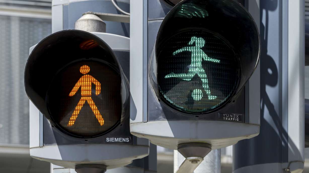A pedestrian light features a woman kicking a soccer ball in Basel, Switzerland, to honor the Women's European Championship being hosted by the country, Friday, July 4, 2025. /Keystone via AP)