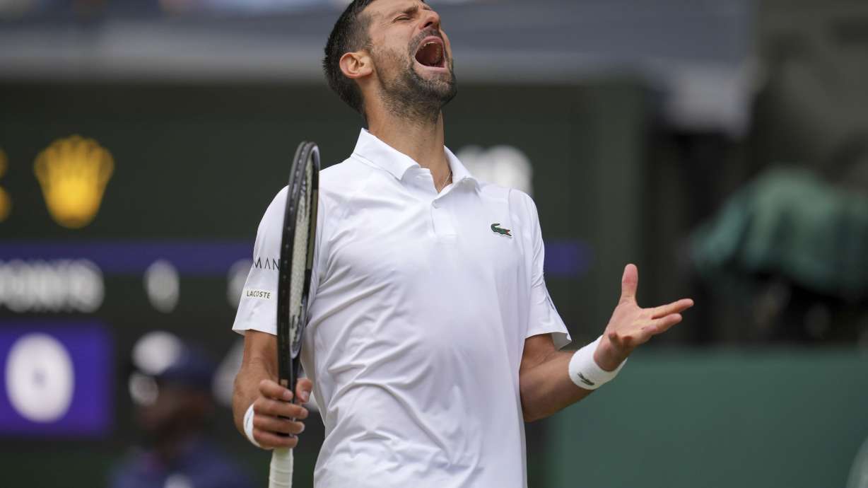 Serbia's Novak Djokovic reacts as he plays Australia's Alex de Minaur during a fourth round men's singles match at the Wimbledon Tennis Championships in London, Monday, July 7, 2025.