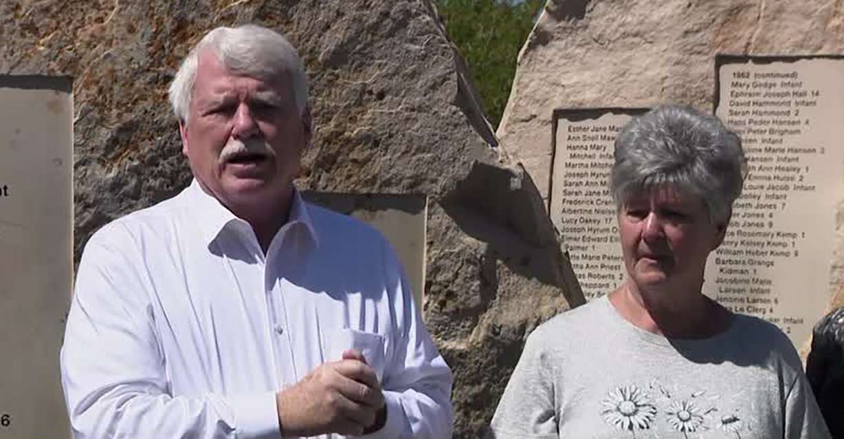 Days of ’47 Executive Vice President Greg James, left, honors Penny Magnusson Hannum, right, who researched stories of hundreds of pioneer children who died along the trek West, at This is the Place Heritage Park in Salt Lake City.