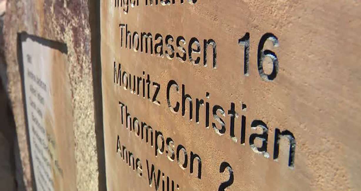 Names of pioneer children who died along the trek West are seen on a stone at This is the Place Heritage Park in Salt Lake City.