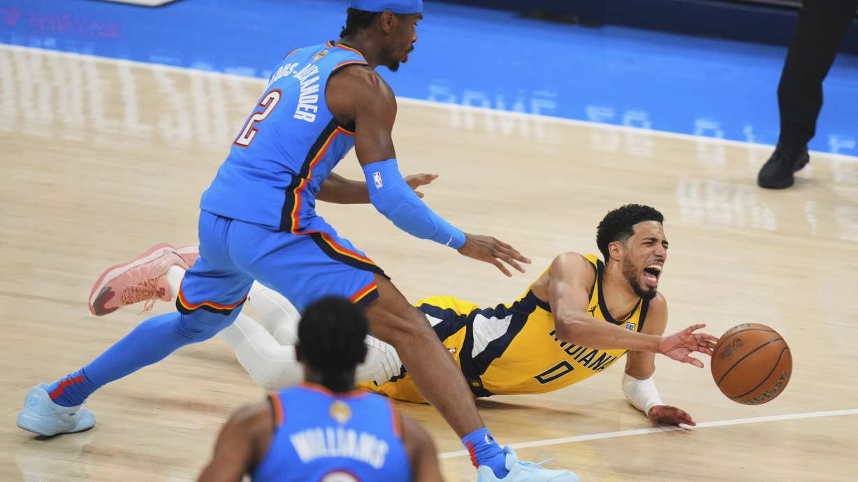 Indiana Pacers guard Tyrese Haliburton (0) falls to the court with an injury during the first half of Game 7 of the NBA Finals basketball series against the Oklahoma City Thunder Sunday, June 22, 2025, in Oklahoma City.