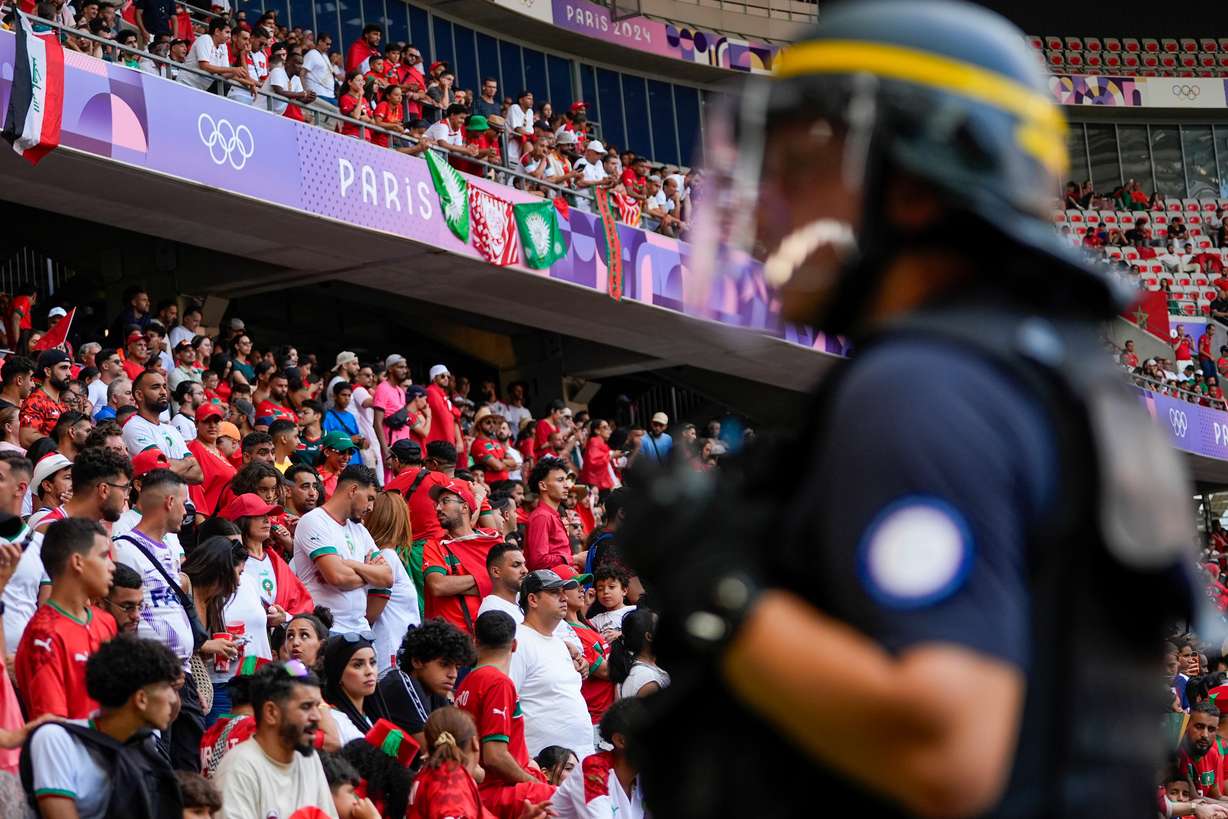 A security official stands guard near the pitch during a men's Group B soccer match between Morocco and Iraq at Nice Stadium at the 2024 Summer Olympics, July 30, 2024, in Nice, France.