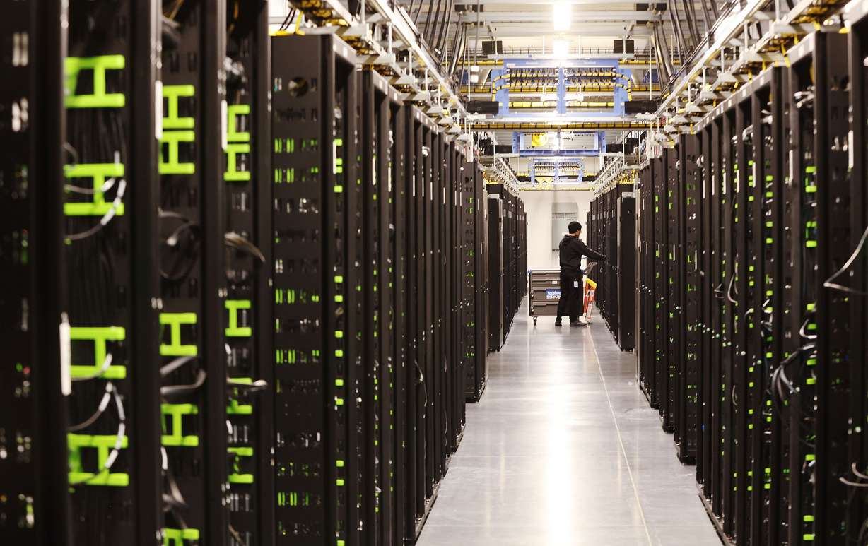 Work is performed on servers at Meta’s Eagle Mountain Data Center in Eagle Mountain on Sept. 30, 2022. Meta is expanding the data center, increasing the total investment to over $1.5 billion. Once completed, the center will be a 4.5-million-square-foot campus.