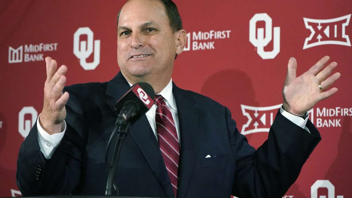 FILE - Oklahoma Athletics Director Joe Castiglione gestures as he speaks during an NCAA college football news conference, Monday, Nov. 29, 2021, in Norman, Okla.