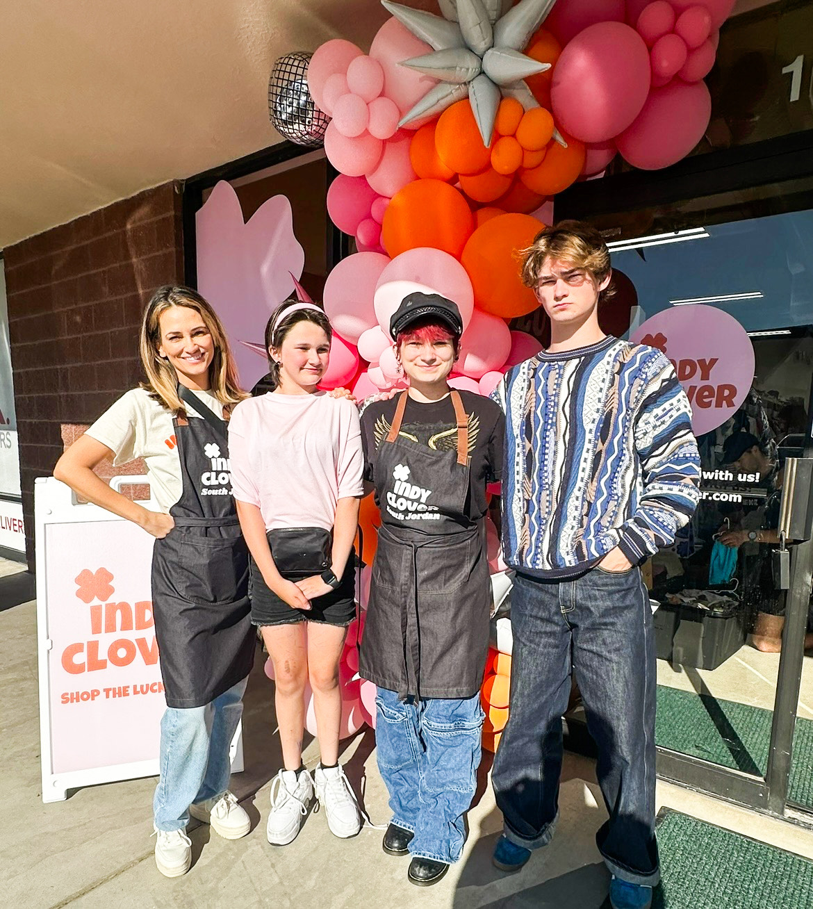 Ashlee Exon, owner of the South Jordan Indy Clover store, and her children — Autumn, Aiden and Wesley — at the store's opening. The store will donate all unsold clothing to Road Home shelters from Aug. 2 to Aug. 16.