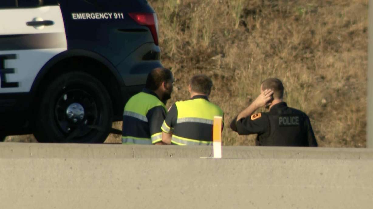 Police investigate after a shootout at an area near I-80 and North Temple in Salt Lake City on June 30. Body camera videos of the intense shooting between an armed driver and Salt Lake police were released Monday.