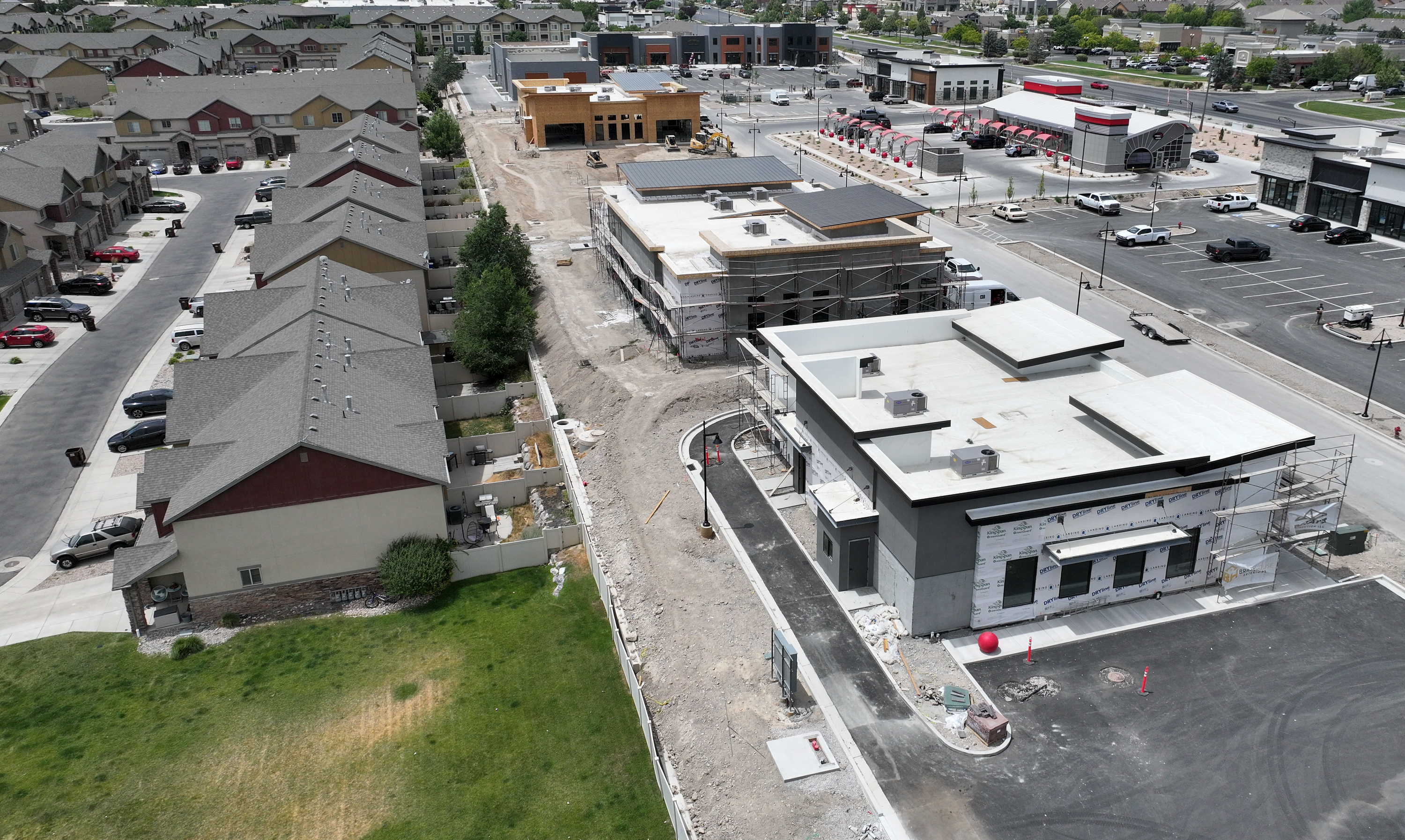 A view of construction at a commercial development near Crossroads Boulevard and Riverside Drive in Saratoga Springs on Thursday. Multiple drive-thrus are being built next to the housing, causing concern among neighboring residents.