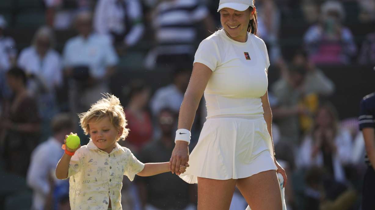 Amanda Anisimova of the U.S. celebrates with her nephew Jackson winning the women's singles quarter finals match against Anastasia Pavlyuchenkova of Russia at the Wimbledon Tennis Championships in London, Tuesday, July 8, 2025.