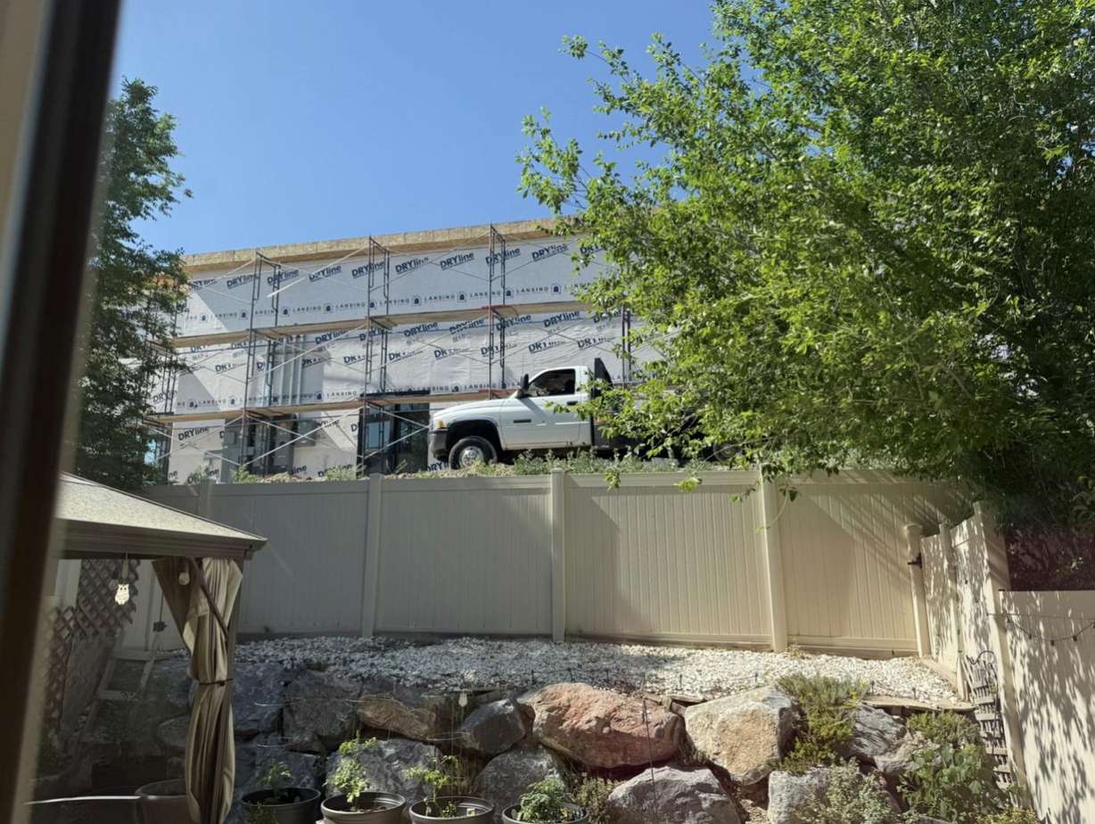 The view from Jill Dusek's backyard shows where multiple drive-thrus are being built behind her townhome community near Crossroads Boulevard and Riverside Drive in Saratoga Springs.