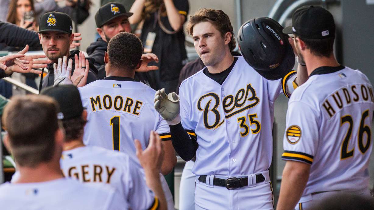 Salt Lake Bees infielder Chad Stevens (35) slaps hands with teammates after driving in a run during a game against Omaha at the Ballpark at America First Square in South Jordan on May 22. Stevens made his major league debut last week.