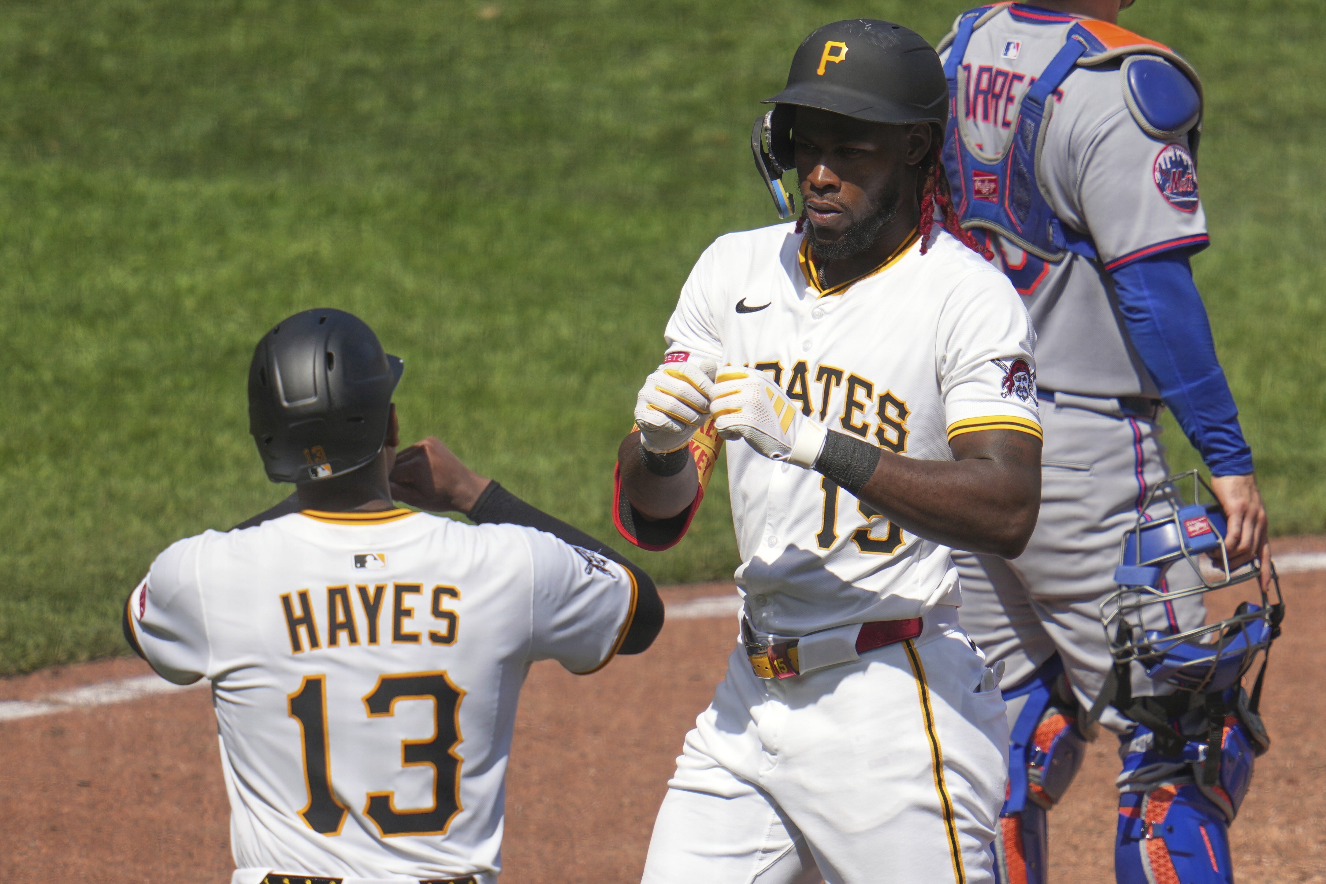 Pittsburgh Pirates' Oneil Cruz, center, celebrates with Ke'Bryan Hayes (13) after both scored on his two-run home run off New York Mets pitcher Dedniel Núñez during the seventh inning of a baseball game in Pittsburgh, Sunday, June 29, 2025.