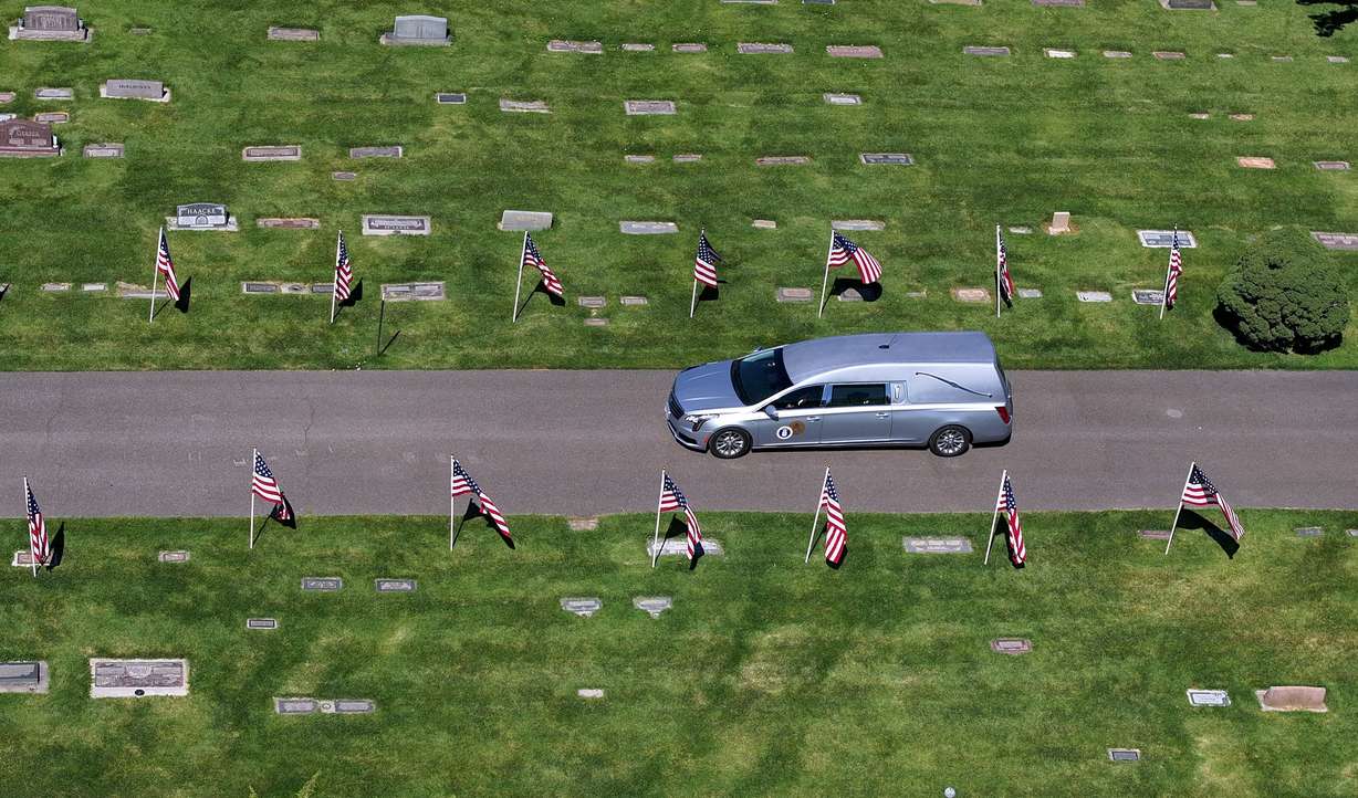 A hearse carrying 1st Lt. George Wilson, an Army aviator and Bountiful native who had been missing in action since 1944, arrives at Bountiful City Cemetery on Tuesday. Wilson's remains arrived in Utah only a few days ago.